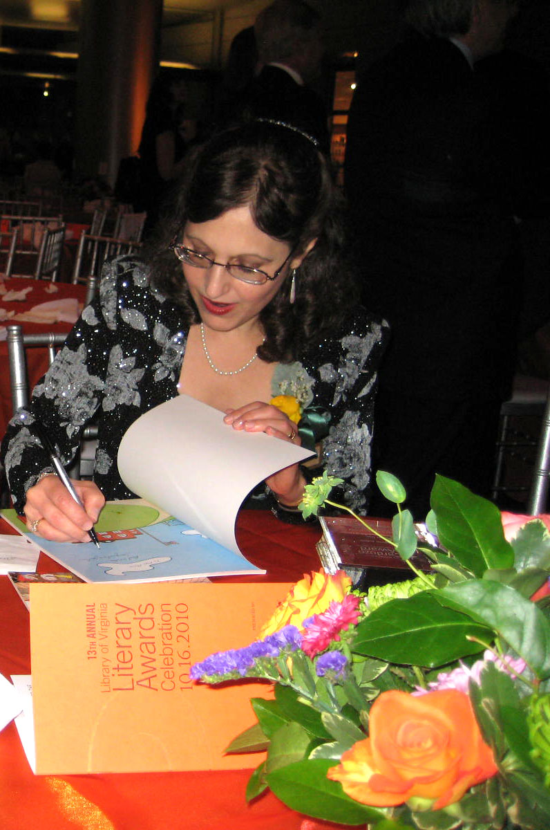 Signing books after the award presentations